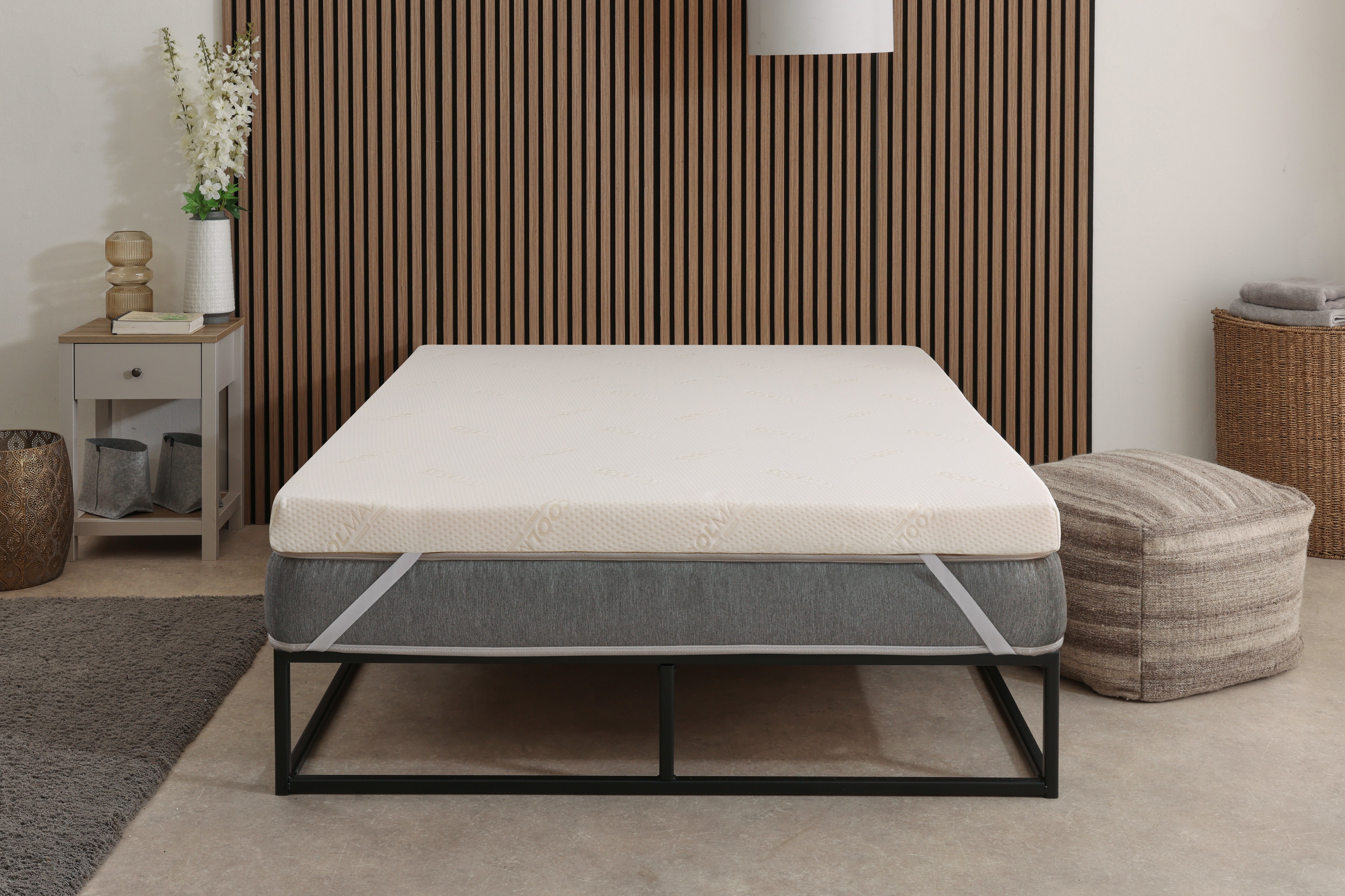 mattress topper on a bed in a lifestyle view